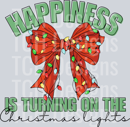 HAPPINESS IS TURNING ON THE CHRISTMAS LIGHTS